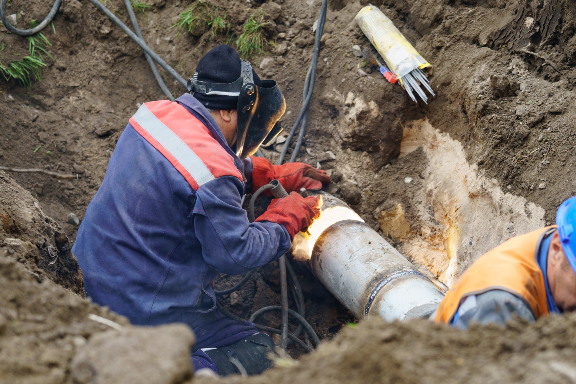 Fixing broken water main. Sewerage pipe repair.